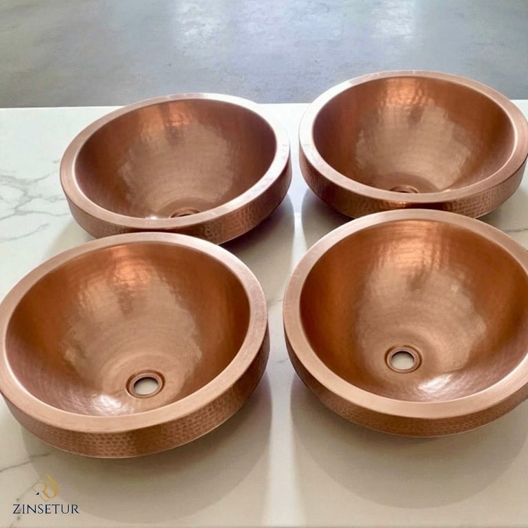 Four round copper bathroom sink bowls